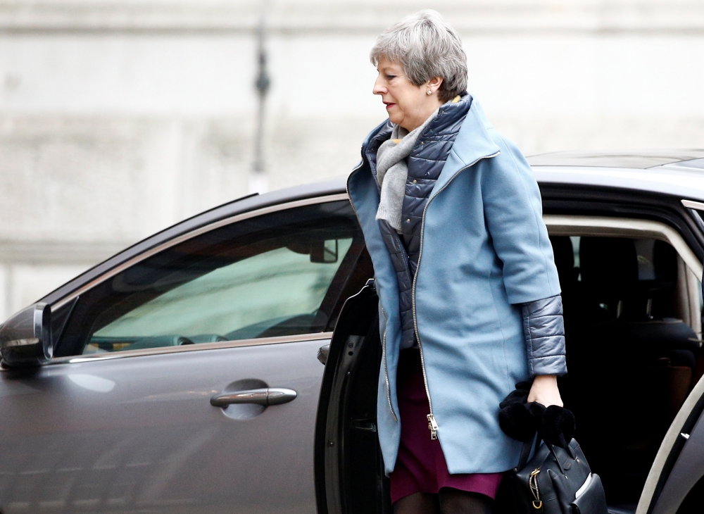 Britain’s Prime Minister Theresa May is seen outside Downing Street in London, Britain, on Friday. — Reuters