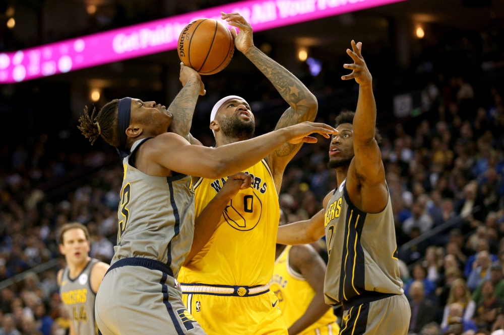 Golden State Warriors center DeMarcus Cousins (0) prepares to attempt a shot next to Indiana Pacers center Myles Turner (33) in the third quarter at Oracle Arena.  — Reuters