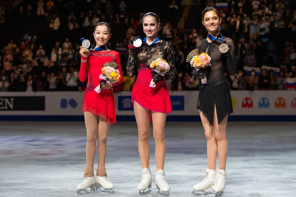 (From L to R) Kazakhstan's Elizabet Tursynbaeva, Russia's Alina Zagitova and Russia's Evgenia Medvedeva pose on the podium for the ladies free skating during the ISU world figure skating championships in the Japanese city of Saitama on Friday. — AFP