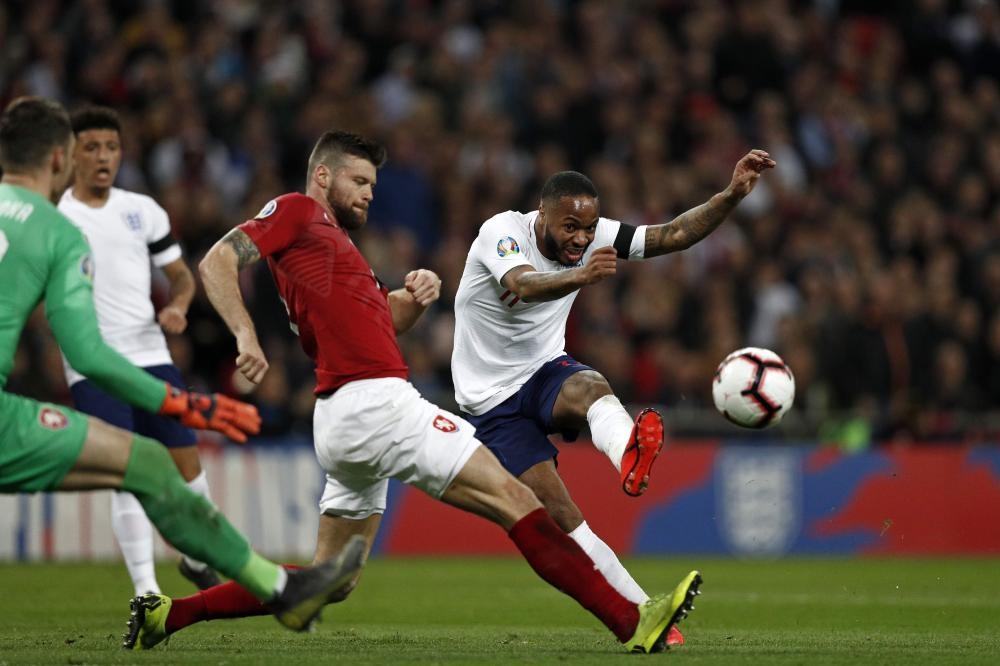 England’s Raheem Sterling (R) shoots to score during the UEFA Euro 2020 Group A qualification match against Czech Replublic at Wembley Stadium in London Friday. — AFP 