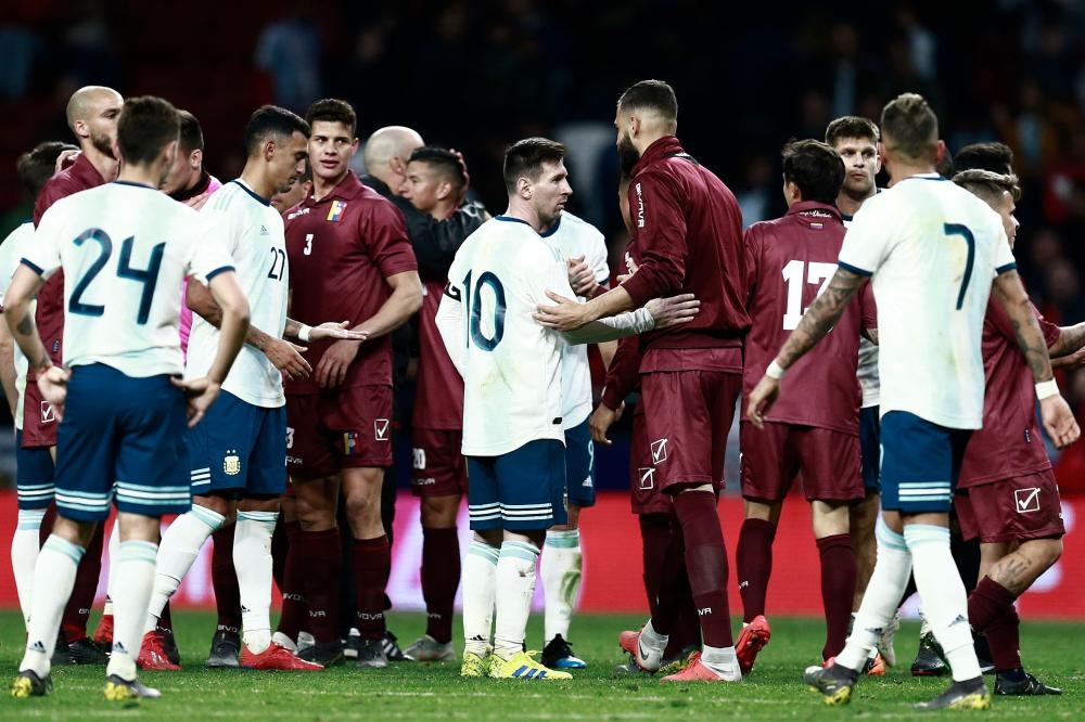 Argentina’s Lionel Messi (C) and teammates congratulate Venezuela’s players at the end of an international friendly match at the Wanda Metropolitano Stadium in Madrid Friday in preparation for the Copa America to be held in Brazil in June and July 2019. — AFP 