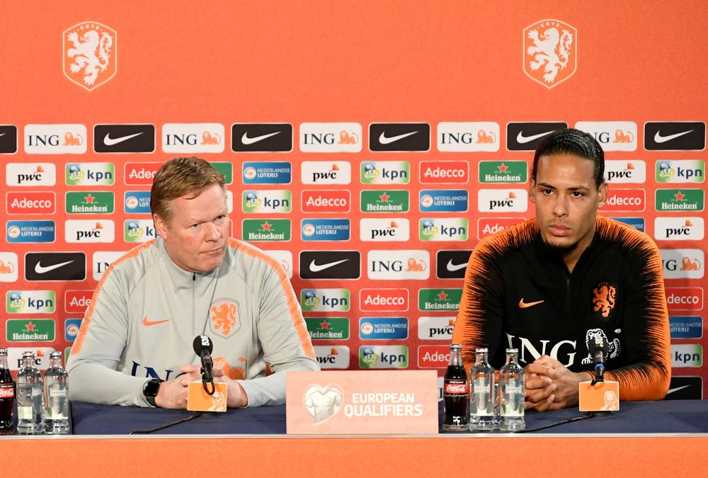 Netherlands coach Ronald Koeman and captain Virgil van Dijk during a press conference at KNVB Campus, Zeist, Netherlands, Saturday. — Reuters