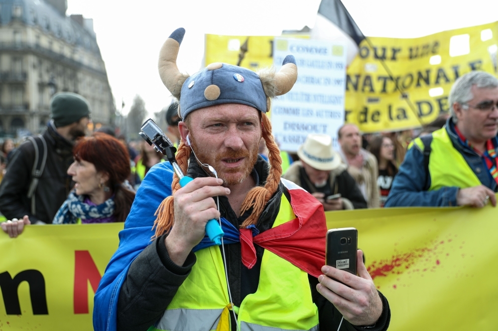 A 'Yellow Vest' protester dressed as a Gaul takes part in an anti-government demonstration in Paris, Saturday. — AFP