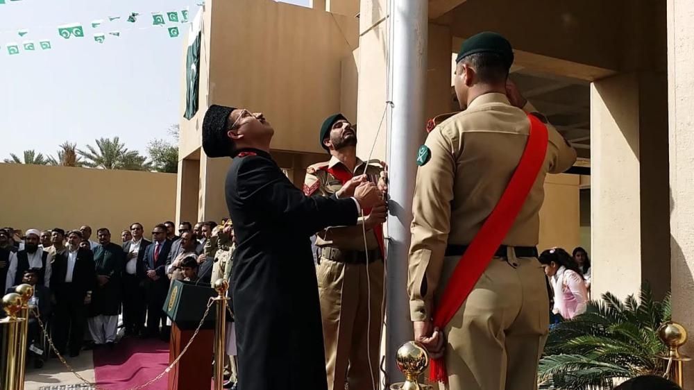 Consul General Shehryar Akbar Khan raises Pakistan's national flag in Jeddah.