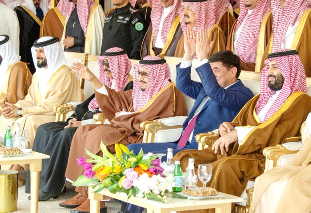 Custodian of the Two Holy Mosques King Salman along with Crown Prince Muhammad Bin Salman and dignitaries at the 3rd King Abdulaziz Camel Festival in Southern Sayahad on Saturday. – SPA