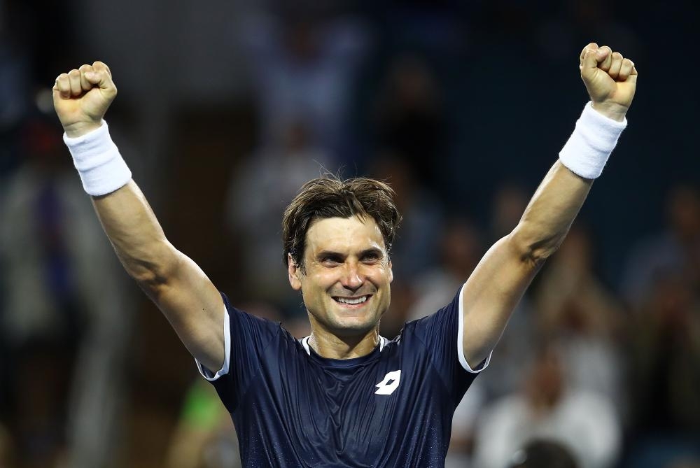 David Ferrer of Spain celebrates after defeating Alexander Zverev of Germany at the Miami Open Tennis in Miami Gardens, Florida, Saturday. — AFP 