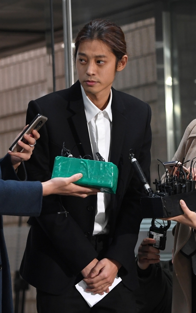 


K-pop star Jung Joon-young arrives to attend a hearing on his arrest warrant at the Seoul central district court in Seoul. — AFP