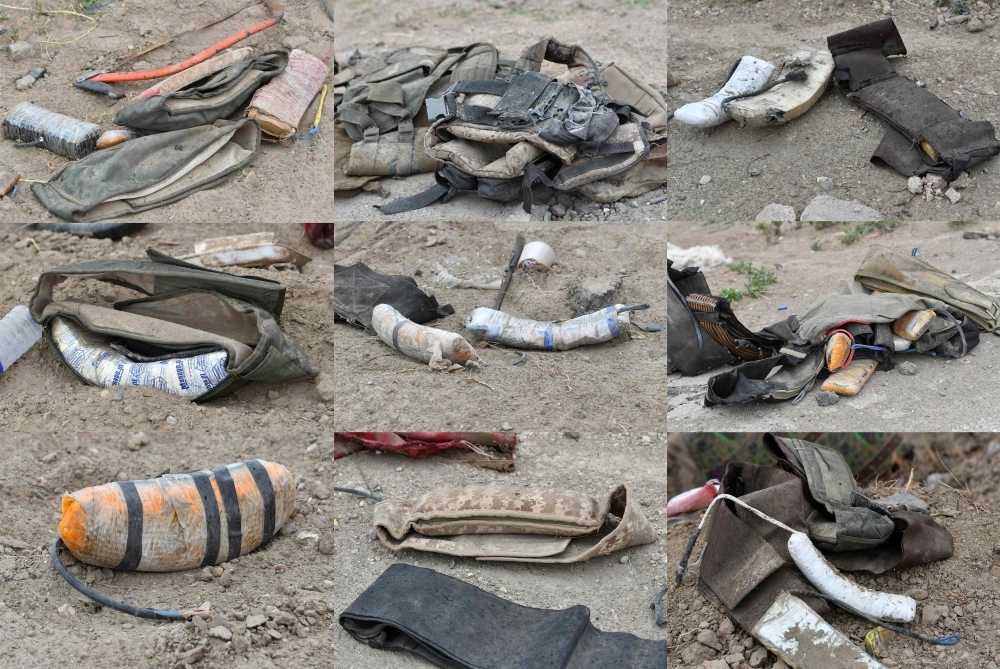 This combination of pictures created on Sunday shows an assortment of improvised explosive devices (IEDs) and explosive belts lying on the ground in the village of Baghouz in Syria's eastern Deir Ez-Zor province near the Iraqi border, a day after Daesh (the so-called IS) group's 