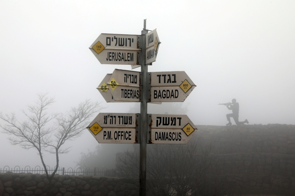Signs pointing out distances to different cities is seen on Mount Bental, an observation point in the Israeli-occupied Golan Heights that overlooks the Syrian side of the Quneitra crossing. — Reuters