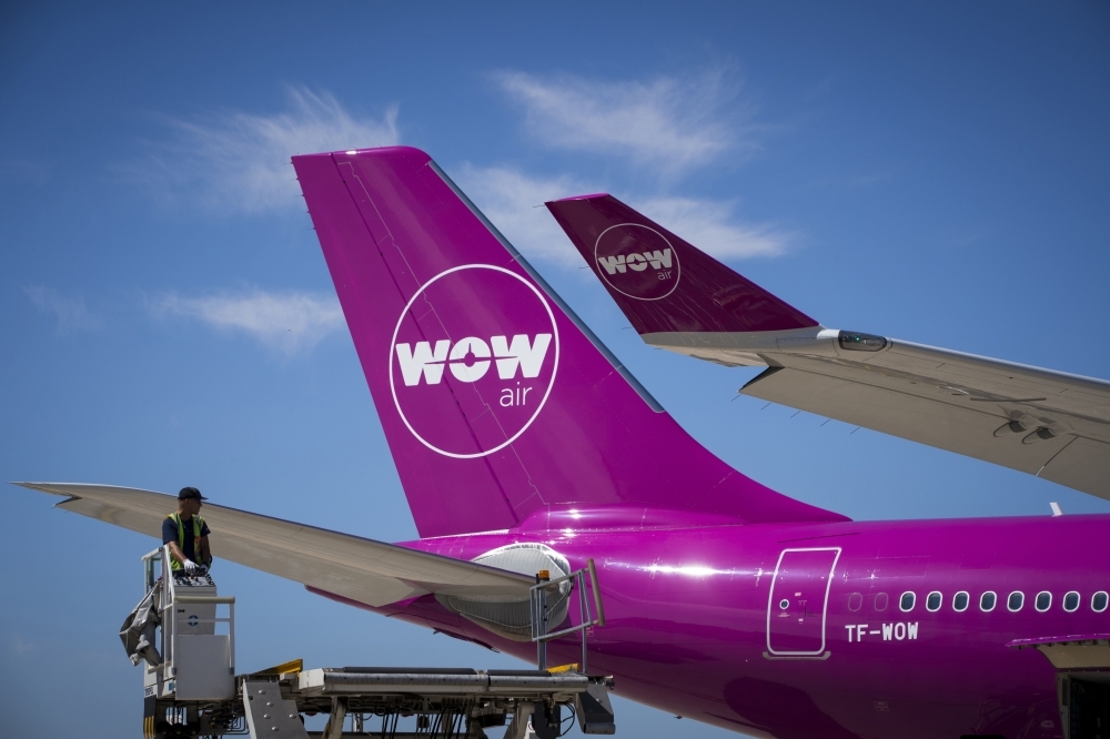 A file picture shows an aircraft of Icelandic low-cost airline WOW Air on the tarmac of Roissy-Charles de Gaulle Airport, north of Paris. Icelandic low-cost airline WOW Air, in difficult financial position, announced on Thursday that it will cease operations and cancel all flights, a decision that is expected to affect thousands of passengers. — AFP