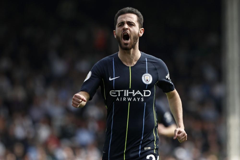 Manchester City's midfielder Bernardo Silva celebrates after scoring the opening goal of the English Premier League football match against Fulham at Craven Cottage in London Saturday. — AFP 