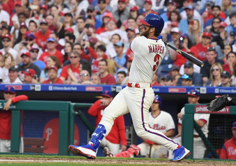 Philadelphia Phillies’ right fielder Bryce Harper hits a solo home run against the Atlanta Braves at Citizens Bank Park in Philadelphia Saturday. — Reuters