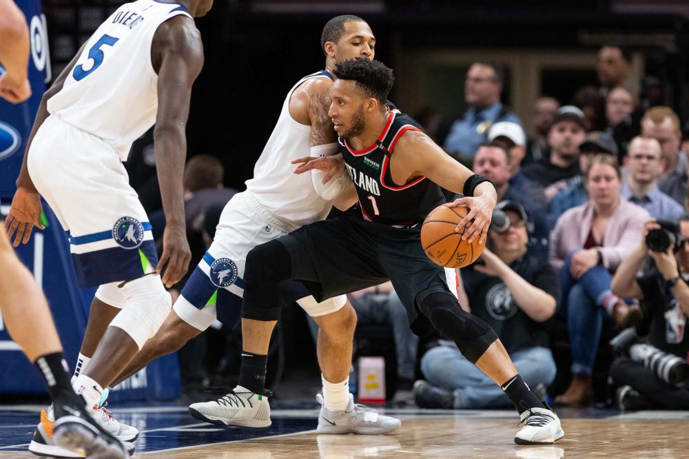 Portland Trail Blazers’ guard Evan Turner drives to the basket as Minnesota Timberwolves’ guard Cameron Reynolds guards him during their NBA game at Target Center in Minneapolis Monday. — Reuters