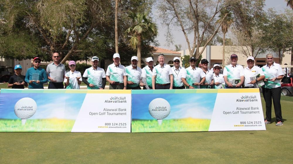 Winners at the 8th Annual Alawwal Bank Open Golf Tournament pose for a group picture.