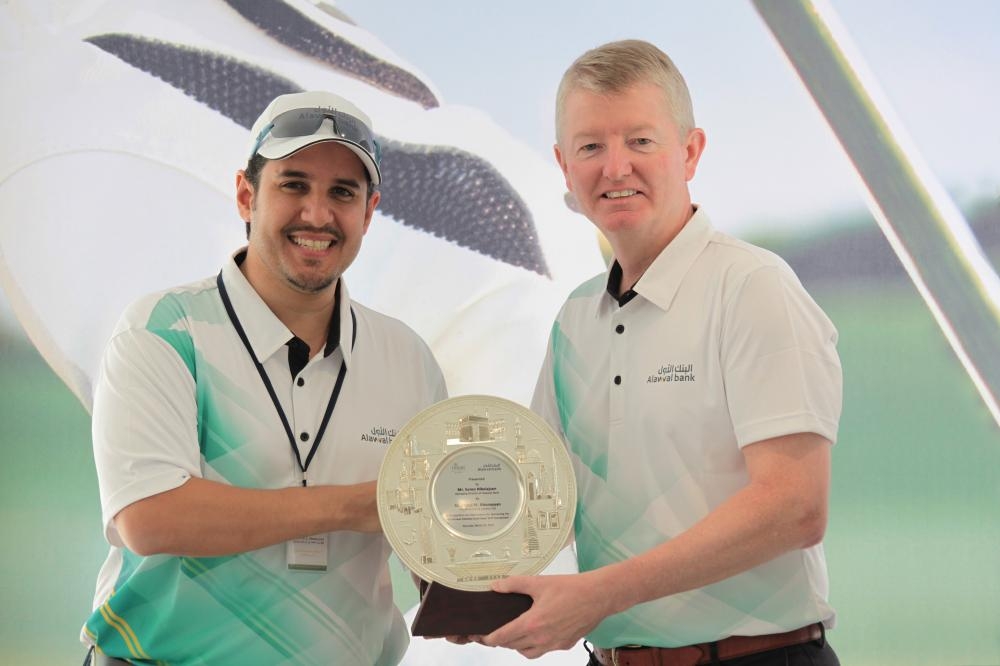 Winners at the 8th Annual Alawwal Bank Open Golf Tournament pose for a group picture.