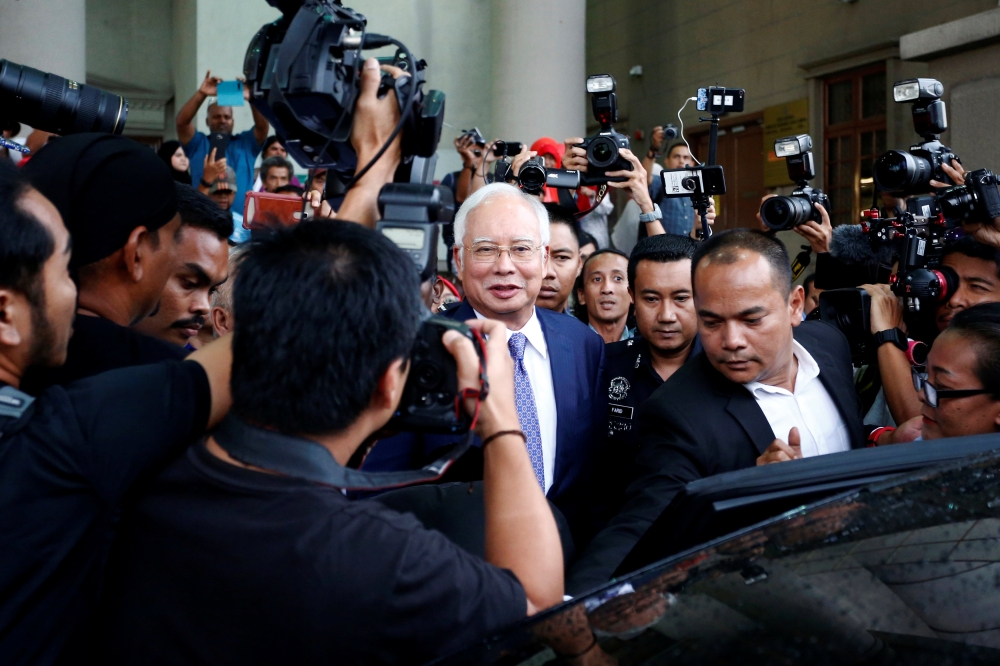 Former Malaysian Prime Minister Najib Razak leaves Kuala Lumpur High Court in Kuala Lumpur on Wednesday. — Reuters