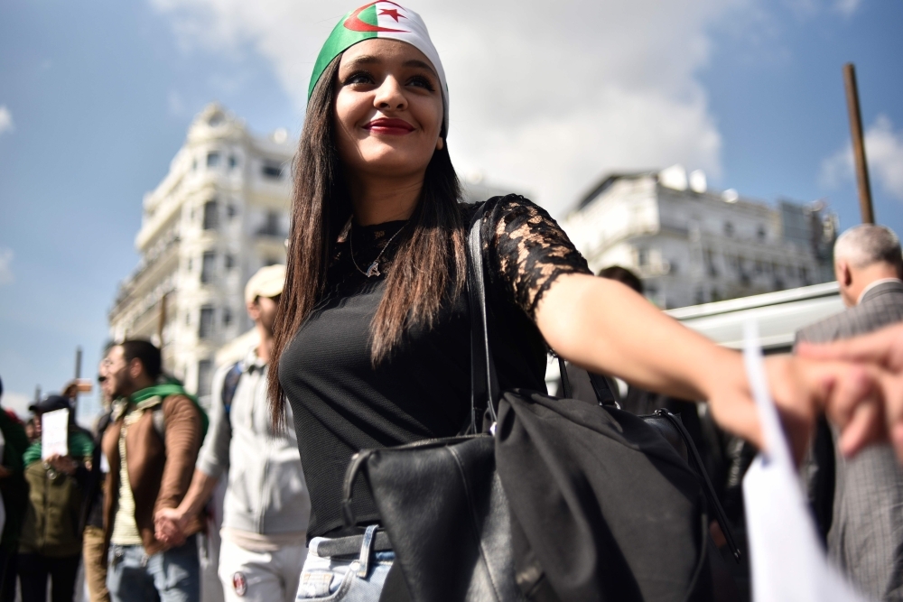 Algerian students celebrate the resignation of President Abdelaziz Bouteflika. — AFP