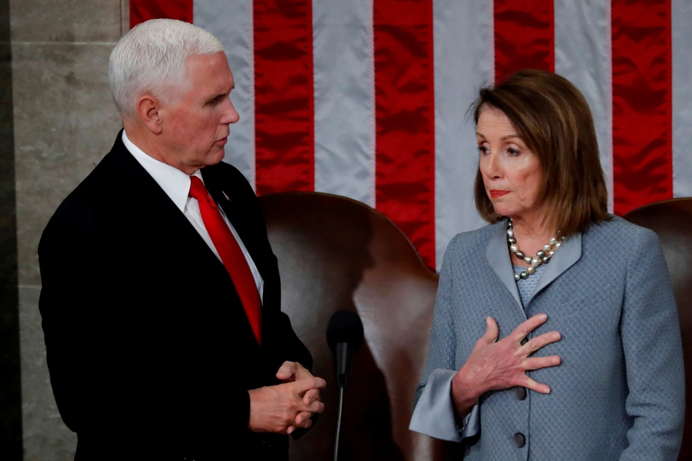 US Vice President Mike Pence stands with House Speaker Nancy Pelosi  prior to NATO Secretary General Jens Stoltenberg address before a joint meeting of Congress inside the House Chamber on Capitol Hill in Washington on Wednesday. — Reuters