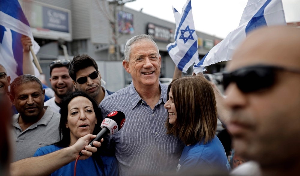 Retired Israeli general Benny Gantz, center, one of the leaders of the Blue and White (Kahol Lavan) political alliance, visits supporters in the Israeli city of Rehovot on Friday, as he campaigns ahead of the parliamentary polls scheduled for April 9.  — AFP