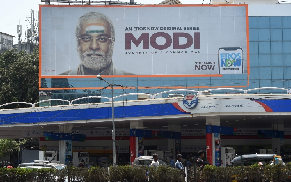 A billboard advertising the TV series on the Indian Prime Minister’s life, ‘Modi: A Common Man’s Journey’, is seen at a junction in Mumbai on Friday. — AFP