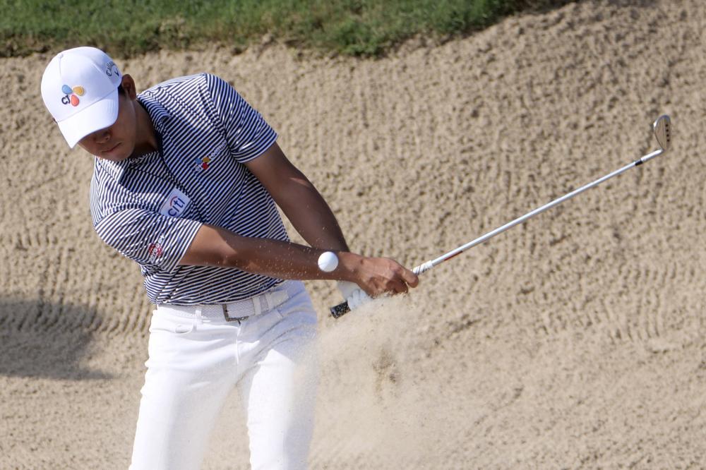 Kim Si-woo hits from the bunker on the fifteenth hole during the second round of the Valero Texas Open Golf Tournament at TPC San Antonio Friday. — Reuters