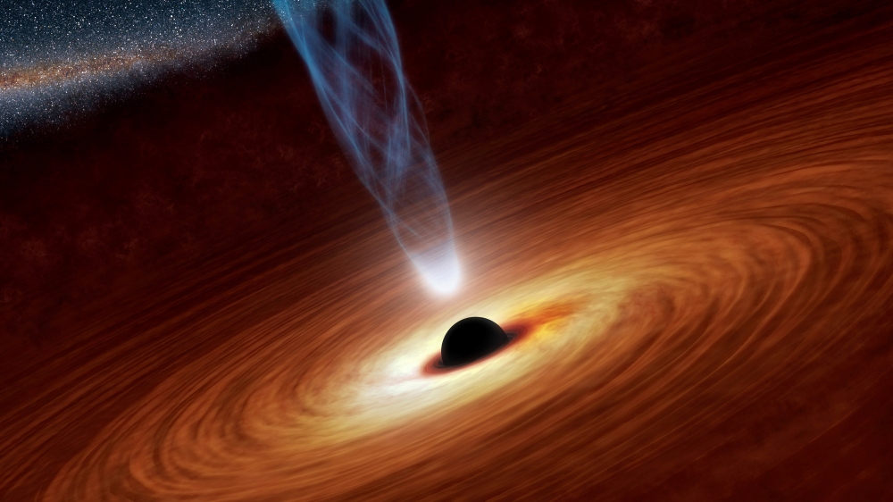 A supermassive black hole with millions to billions times the mass of our sun is seen in an undated NASA artist's concept illustration. — Reuters