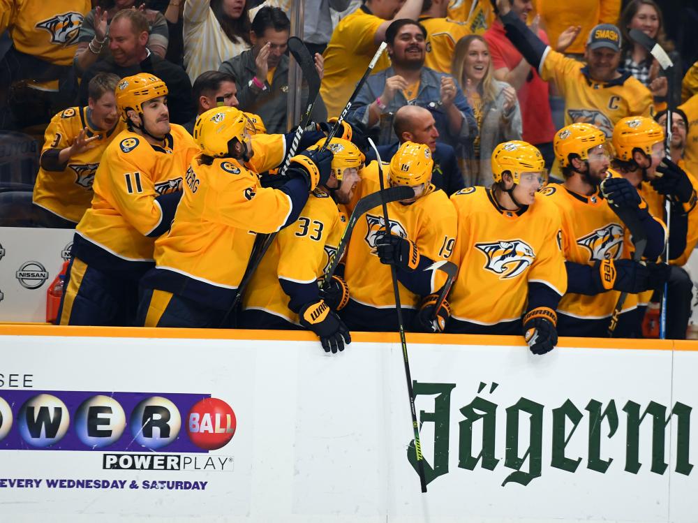 Nashville Predators players celebrate after beating Chicago Blackhawks for the Central Division title at Bridgestone Arena in Nashville Saturday. — Reuters