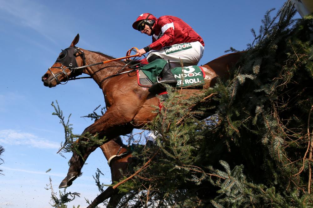 Tiger Roll, ridden by Davy Russell, in action during the 5.15 Randox Health Grand National Handicap Chase at Aintree Racecourse, Liverpool, Saturday. — Reuters