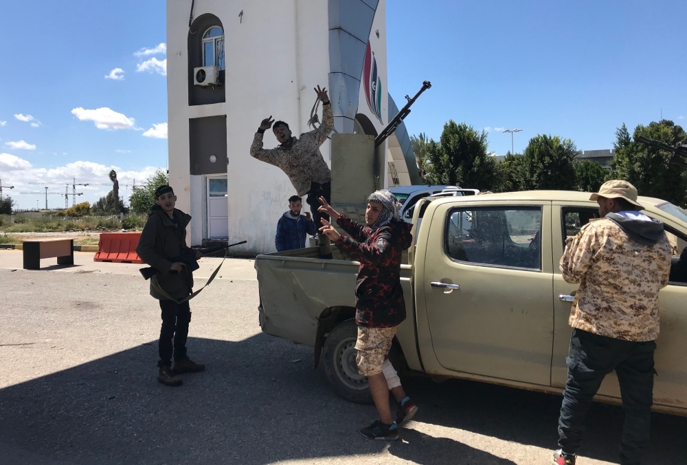 


Forces loyal to the internationally recognized Libyan Government of National Accord (GNA) are pictured at the entrance leading to Tripoli's old airport, Monday. — AFP