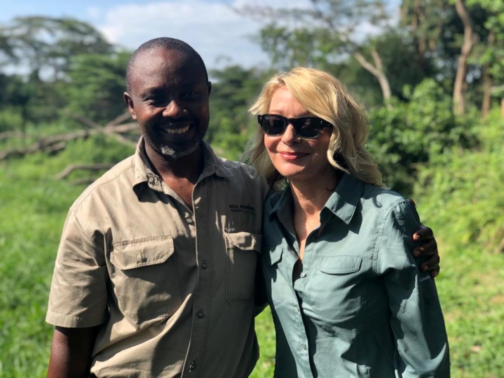 US tourist Kimberly Sue Endicott poses with her guide, Jean Paul Mirenge in Uganda, on April 7, 2019, in this image taken from social media. — Reuters