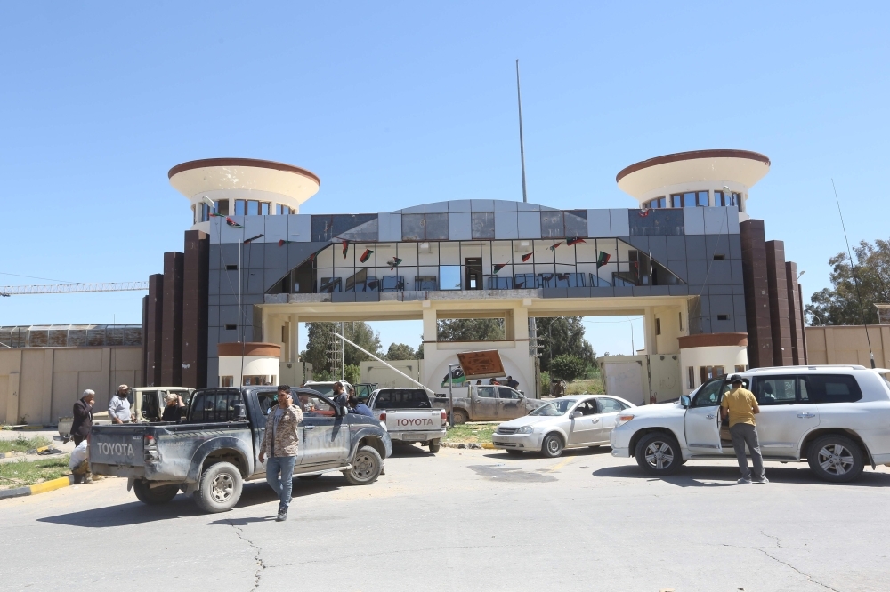 


Gun-mounted vehicles belonging to fighters loyal to the internationally-recognized Libyan Government of National Accord (GNA) are pictured near a military compound in a suburb of the capital Tripoli, Tuesday. Libya's warring parties today faced mounting international pressure to halt fighting near the capital that has caused thousands to flee and left several dozen people dead. — AFP photos