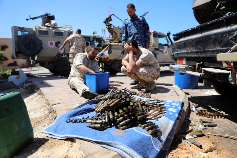 


Gun-mounted vehicles belonging to fighters loyal to the internationally-recognized Libyan Government of National Accord (GNA) are pictured near a military compound in a suburb of the capital Tripoli, Tuesday. Libya's warring parties today faced mounting international pressure to halt fighting near the capital that has caused thousands to flee and left several dozen people dead. — AFP photos