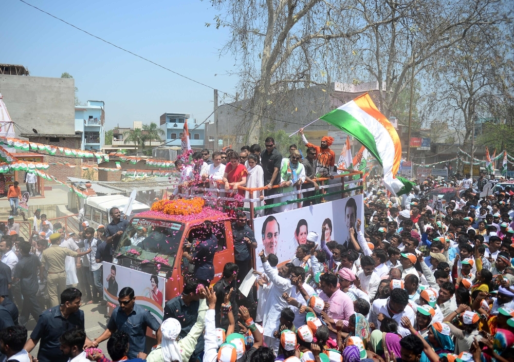 Indian National Congress party president Rahul Gandhi, left, and his sister Priyanka Gandhi Vadra, right, Congress party’s general secretary for eastern Uttar Pradesh state, take part in a roadshow rally ahead of the upcoming general election in Amethi on Wednesday. — AFP