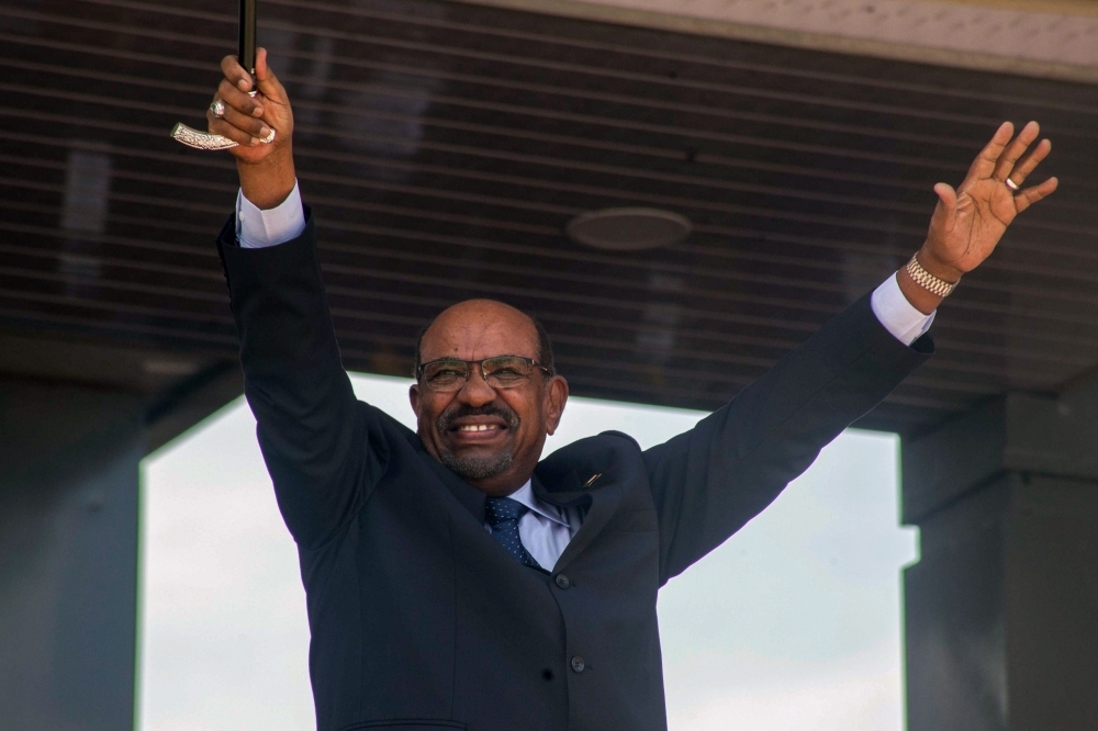Sudanese President Omar Bashir gestures during a peace ceremony at John Garang Mausoleum in Juba, South Sudan, in this Oct. 31, 2018 file photo. — AFP