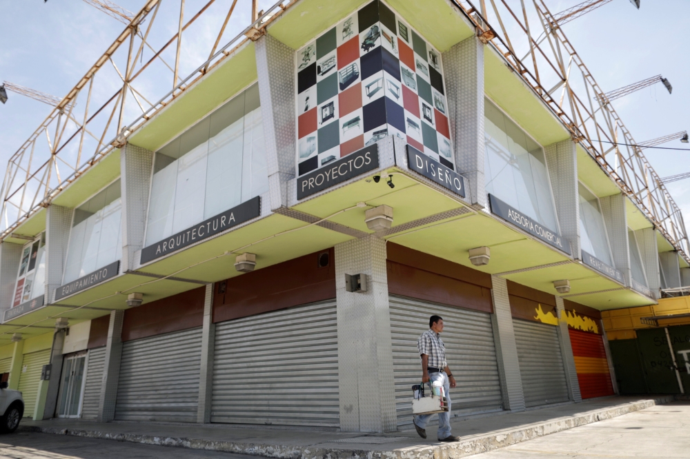 A man walks past closed local shops in Valencia, Venezuela, Venezuela, in this April 8, 2019 file photo. — Reuters