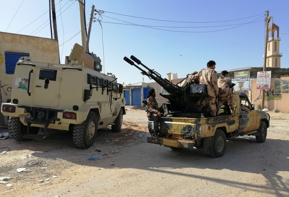 Troops from eastern Libyan forces are seen in Ain Zara, south of Tripoli, Libya, on Thursday. — Reuters