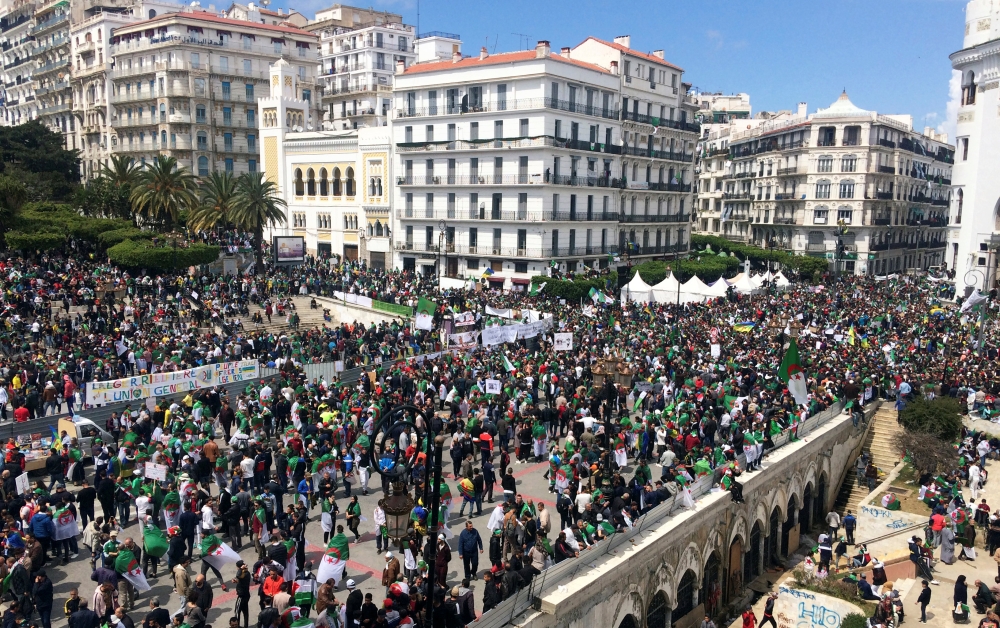 People protest to demand political change and the departure of the ruling elite in Algiers, Algeria, on Friday. — Reuters