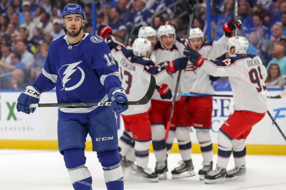 Cedric Paquette (L) of the Tampa Bay Lightning reacts as Columbus Blue Jackets’ players celebrate their victory in Game Two of the Eastern Conference Stanley Cup Playoffs at Amalie Arena in Tampa, Florida, Friday. — AFP 