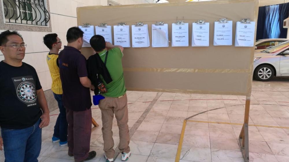 Philippine Consul General Edgar B. Badajos overseeing poll arrangements at consulate premises on Saturday. — SG photo

