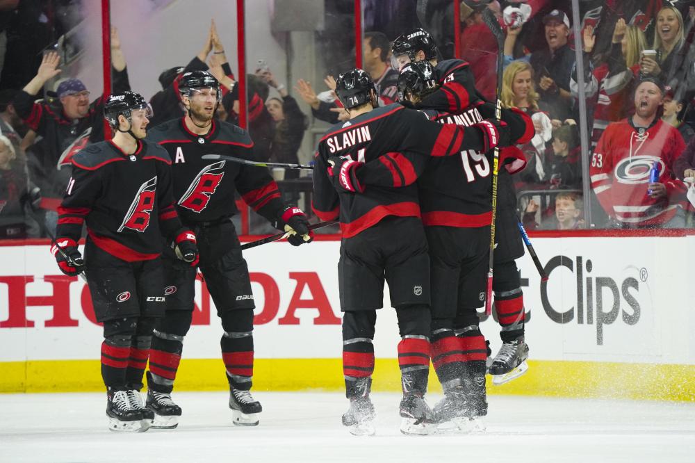 Carolina Hurricanes’ players celebrate his third their victory over Washington Capitals in Game 3 of the first round of the 2019 Stanley Cup Playoffs at PNC Arena in Raleigh Monday. — Reuters 