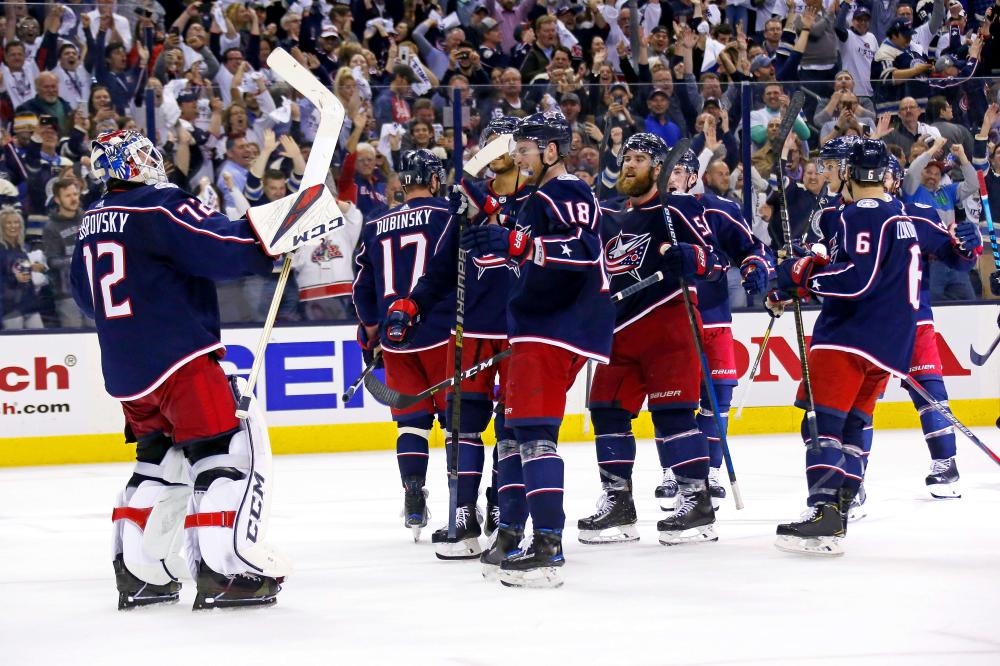 Goalie Sergei Bobrovsky (L) of the Columbus Blue Jackets is congratulated by teammates after defeating the Tampa Bay Lightning 7-3 in Game 4 of the Eastern Conference Stanley Cup Playoffs at Nationwide Arena in Columbus, Ohio, Tuesday. — AFP