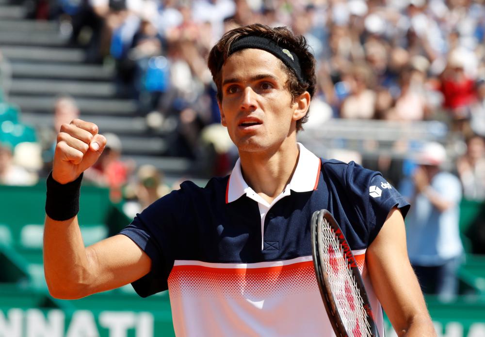 France’s Pierre-Hugues Herbert celebrates after winning his second round match against Japan’s Kei Nishikori at the Monte Carlo Masters Wednesday. — Reuters