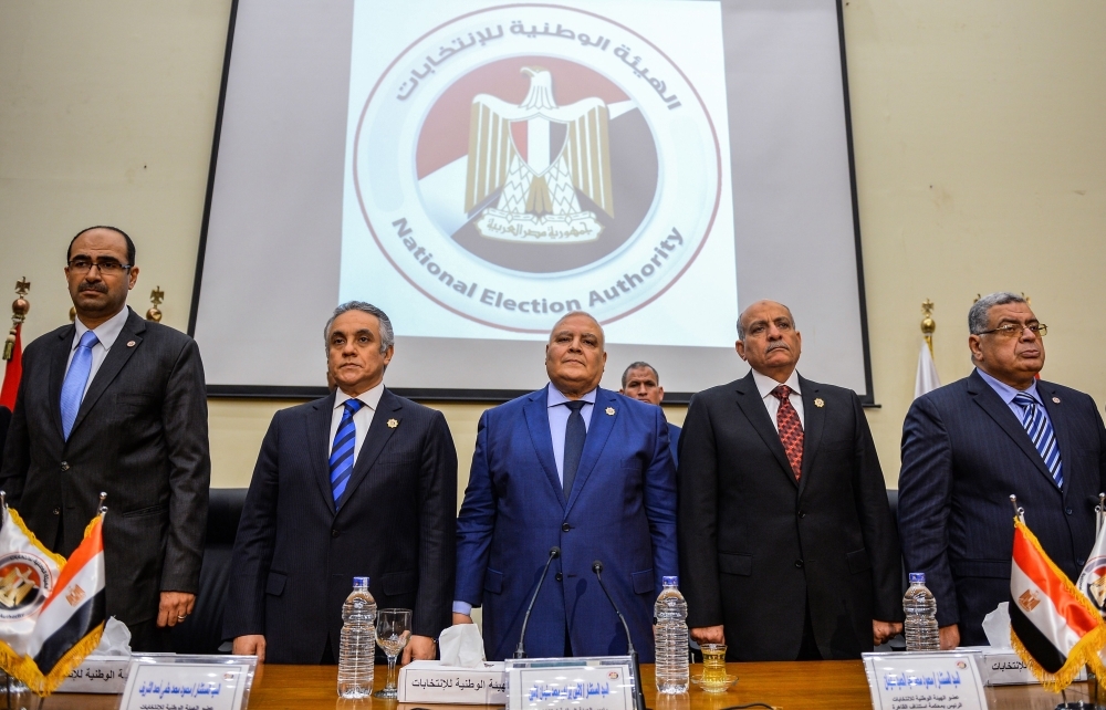 Lasheen Ibrahim, center, chief of Egypt’s National Election Authority (NEA), gives a press conference in the capital Cairo on Wednesday. — AFP