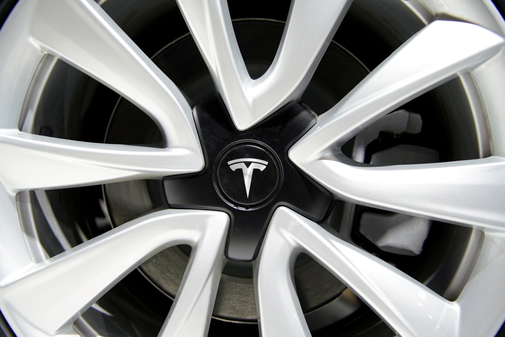 A Tesla logo is seen on a wheel rim during the media day for the Shanghai auto show in Shanghai, China, in this recent photo. — Reuters