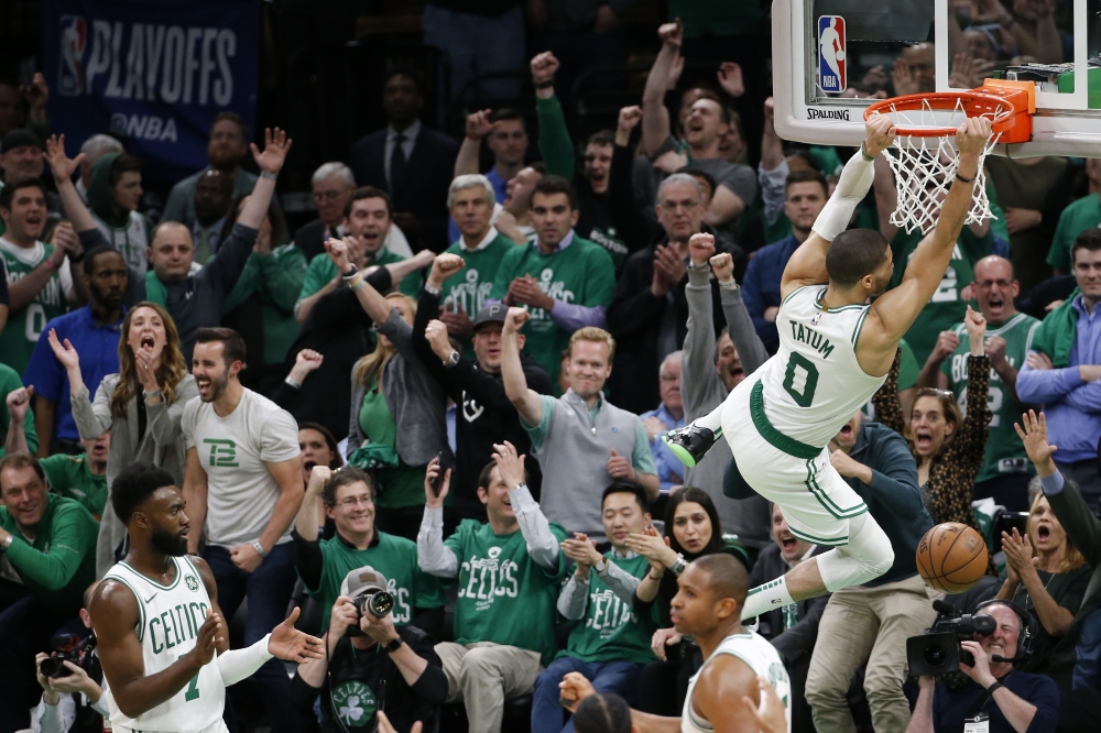 Boston Celtics forward Jayson Tatum (0) reacts after dunking the ball during the second half in game two of the first round of the 2019 NBA Playoffs against the Indiana Pacers at TD Garden. — Reuters
