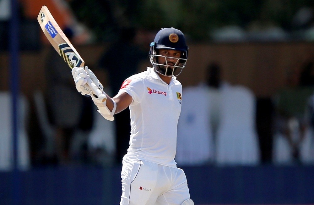 File photo shows Sri Lanka's Dimuth Karunaratne celebrating his half century during the Third Test against England in Colombo, Sri Lanka. — Reuters