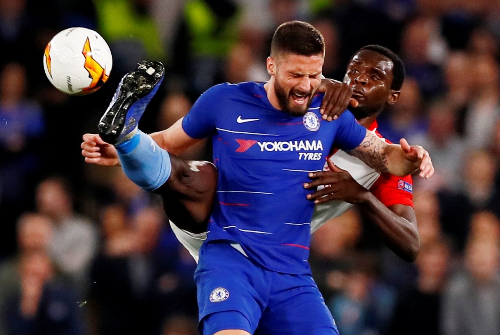 Chelsea's Olivier Giroud in action with Slavia Prague's Michael Ngadeu-Ngadjui during the Europa League quarterfinal second leg clash at Stamford Bridge, London, Britain, on Thursday. — Reuters