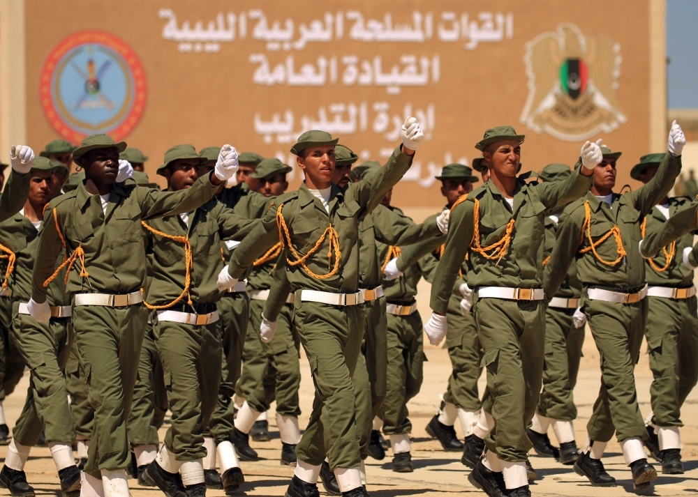 Fighters from the self-proclaimed Libyan National Army loyal to Khalifa Haftar attend their graduation ceremony at a military academy in Libya's eastern city of Benghazi on Thursday. — AFP