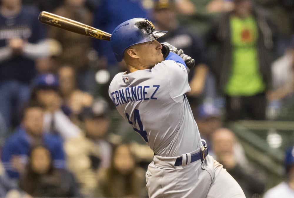 Los Angeles Dodgers’ center fielder Enrique Hernandez follows through on a swing for a three-run home run against the Milwaukee Brewers at Miller Park in Milwaukee Friday. — Reuters