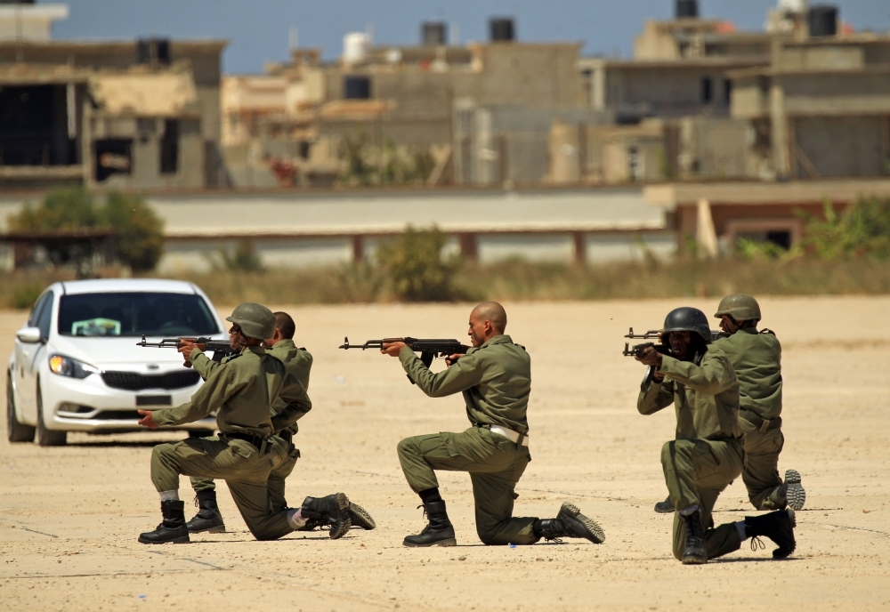 Fighters from the self-proclaimed Libyan National Army loyal to Khalifa Haftar attend their graduation ceremony at a military academy in Libya's eastern city of Benghazi on April 18, 2019. — AFP